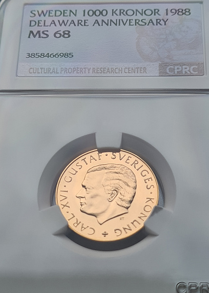картинка Швеция. 1000 Крон 1988 г. Золото. 5.8 г*0.900 0.1678 oz. 350-летие Шведской Колонии в Америке! СЛАБ CPRC MS 68! от магазина Одежда+ 3